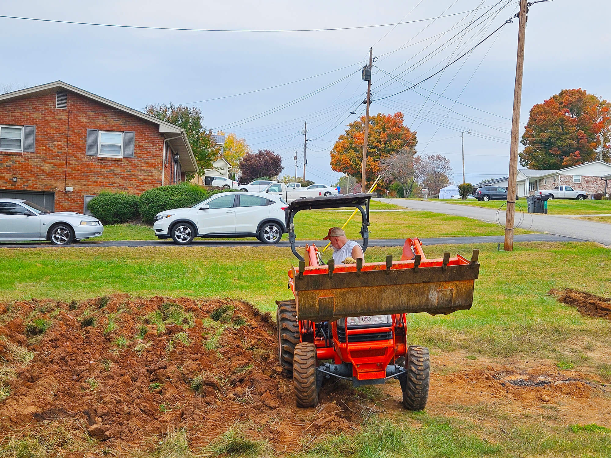 The urban garden soil being turned through plowing.